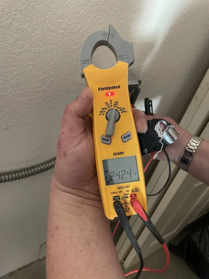Voltage testing with clamp meter during Circuit Breaker Repair in Columbia Falls